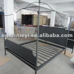 Vintage iron bed with round mosquito net