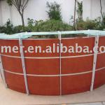 semi-circular wood reception desk with glass stand panel