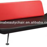 Red color salon waiting chair