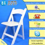 white wooden folding chair