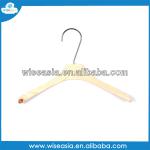 yellow wooden clothes hanger with clip