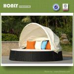 Rattan round sun lounger or patio daybed with canopy